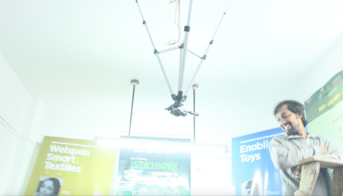 Varun in our calibration room. We used various posters for the MIT workshop as patterns and of course the tripod hanging from the ceiling to hold the camera.
